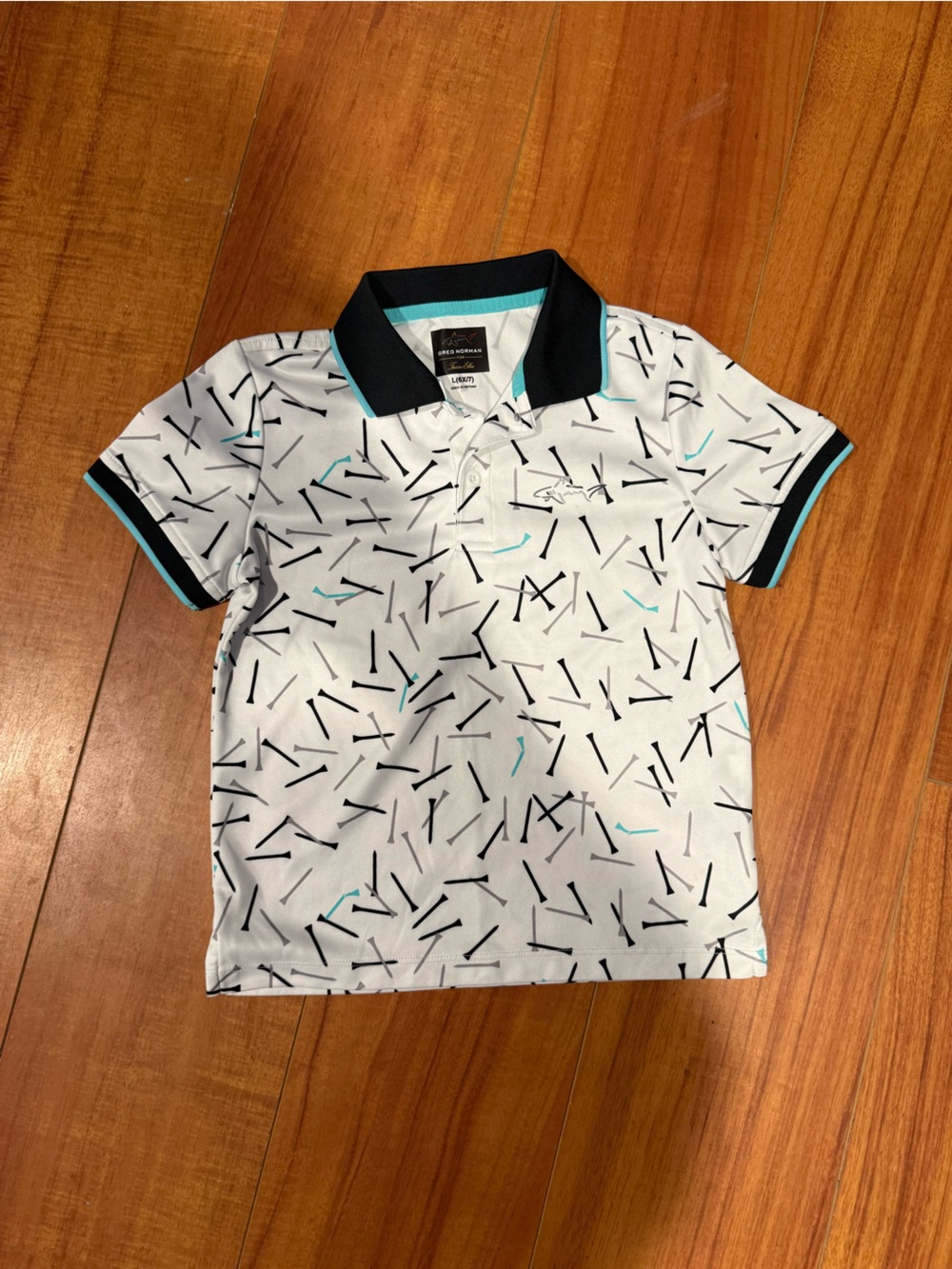 Greg Norman Collection White Polo with Black & Teal Accent Print
